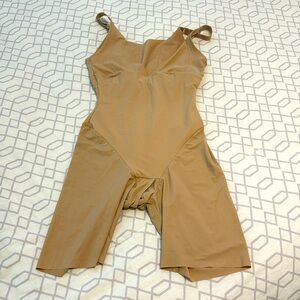 Maidenform shaper. Can be worn with a bra